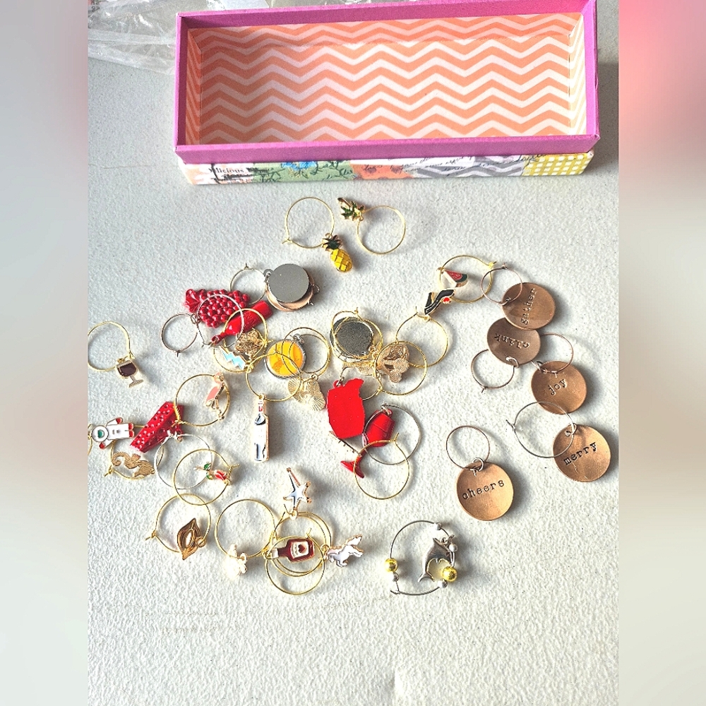 Cute box full of 36 wine charms. No two alike,could be used for charms/jewelery.